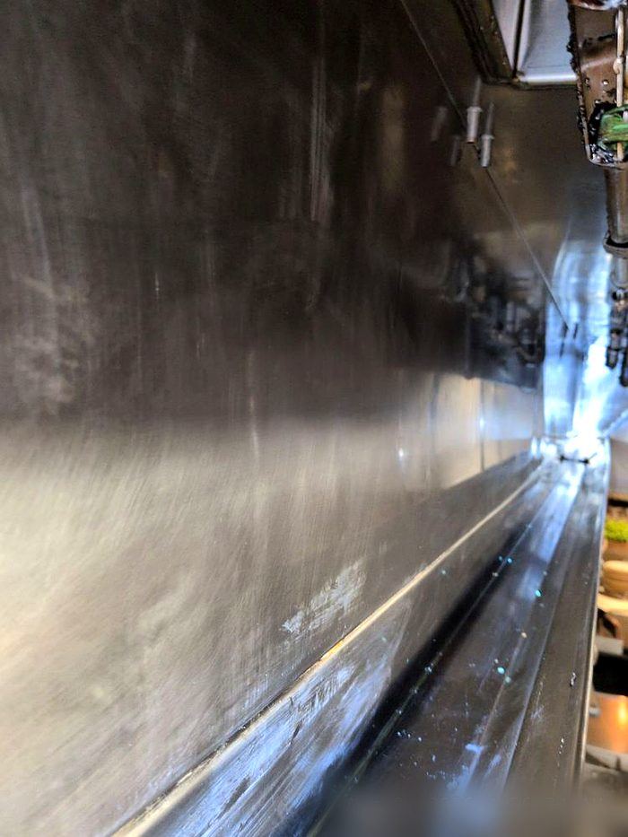 Same exhaust duct interior cleaned to bare metal